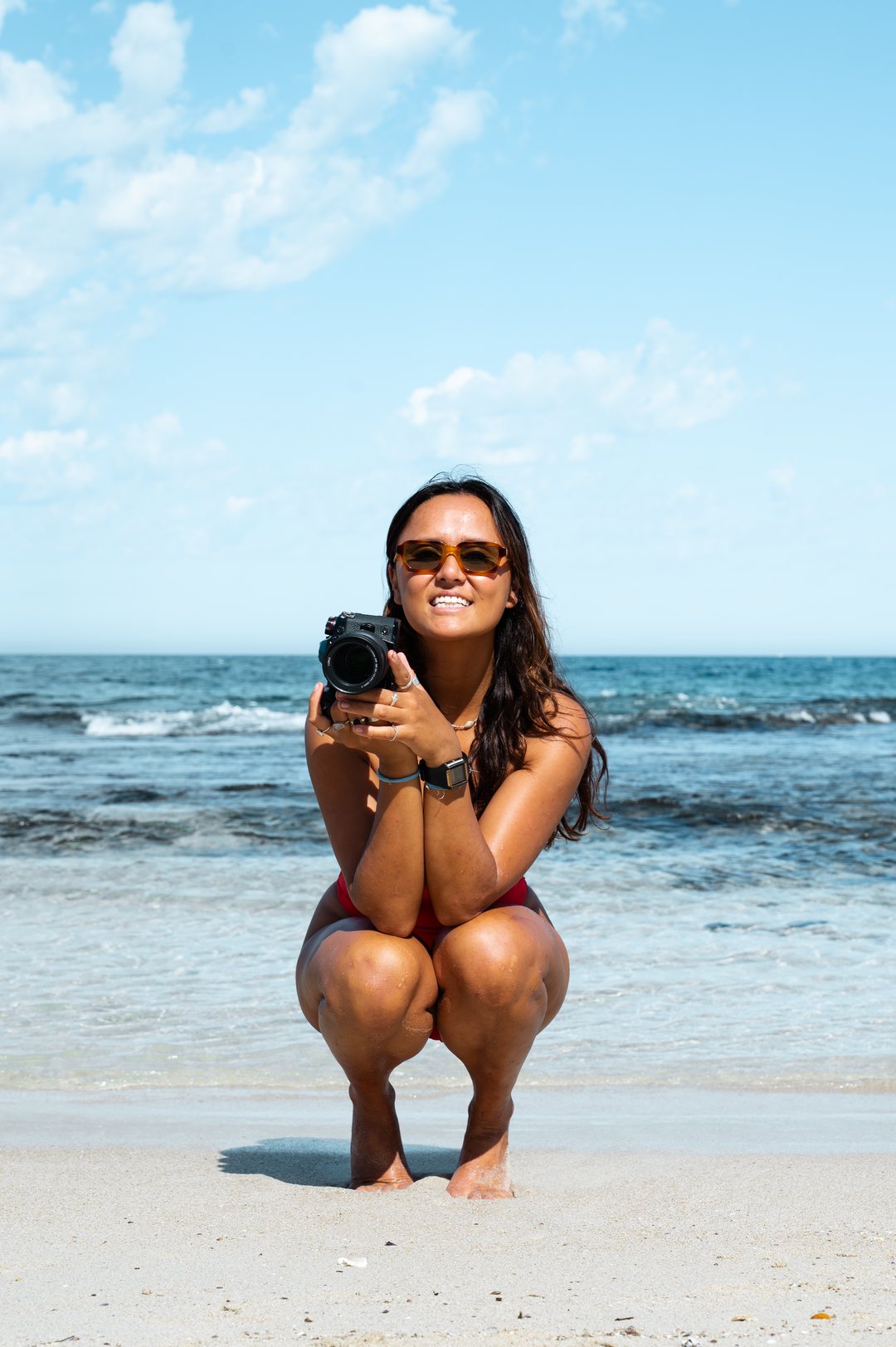 Hannah on beach with camera